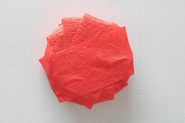 Wrap crepe paper around pie surprise ball
