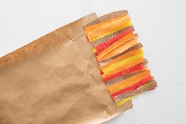 Crepe paper strips taped on kraft paper