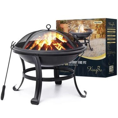 Outdoor fire pit for wood logs with cover and poker.