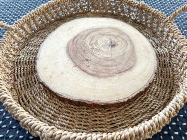 basket and wood round for fall floral centerpiece