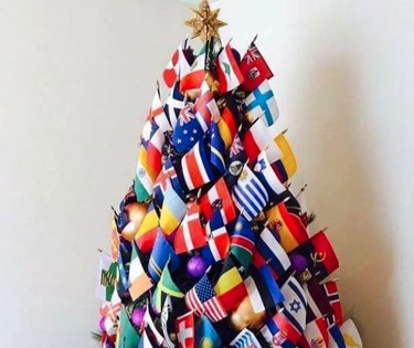 Christmas tree covered in world flags