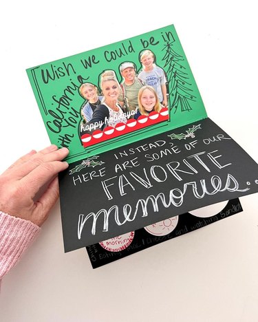 Card with multiple pages, decorated with writing and a family photo