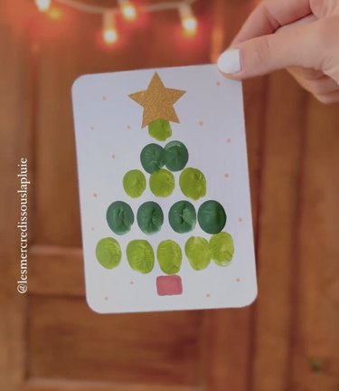 Card with Christmas tree made from green fingerprints
