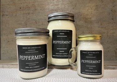 White peppermint candles in Mason jars