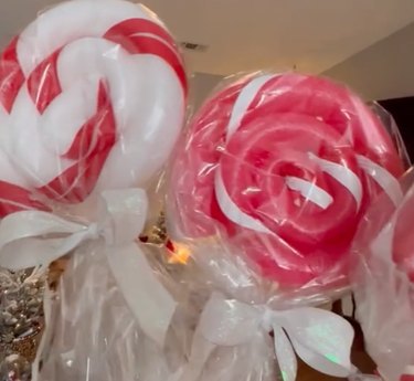 Two jumbo peppermint decorations made from pool noodles