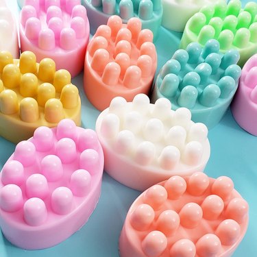 Colorful soap bars with bumpy massage protrusions