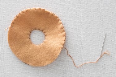 Stitch tan felt circles for DIY bagel ornament