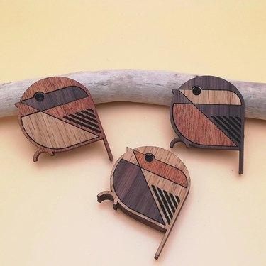 Three magnets shaped like wood birds