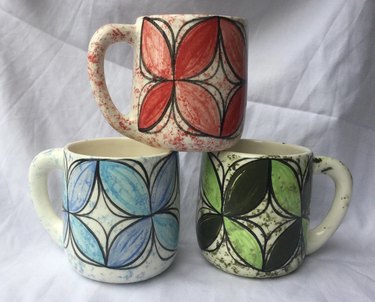 Set of colorful coffee mugs with retro floral design