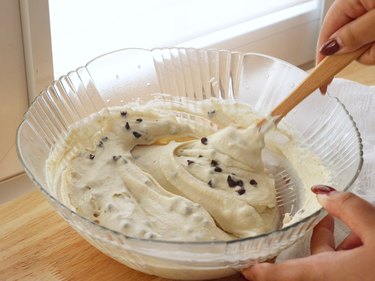 Folding in mini chocolate chips with silicone spatula.