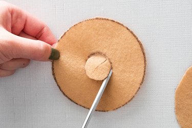 Cut felt pieces to make a DIY bagel ornament