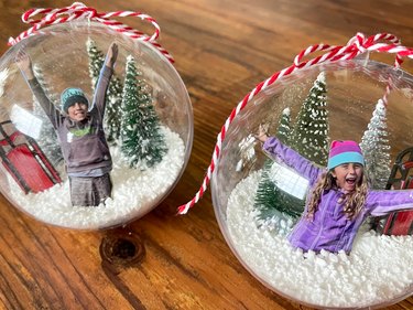 two finished photo snow globe ornaments