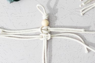 Two lark knots made with macrame cord