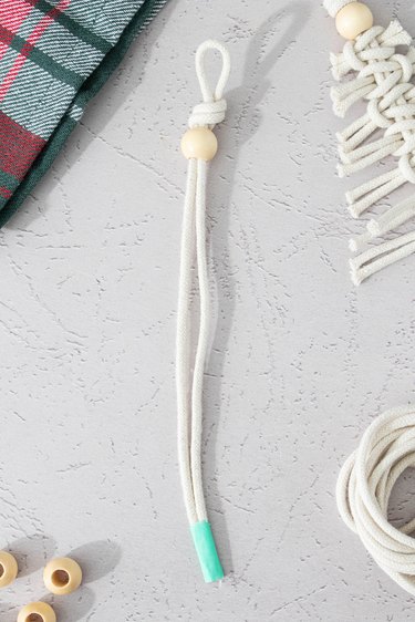 Macrame cord with wooden bead