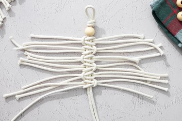 Tie six lark knots with macrame cord