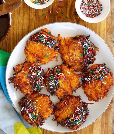 Sweet potato latkes dipped in chocolate and topped with rainbow sprinkles