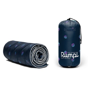 Rumpl original puffy blanket shown tucked into its carrying pouch and rolled up. The pattern is navy blue with pink, purple, and aqua dots.