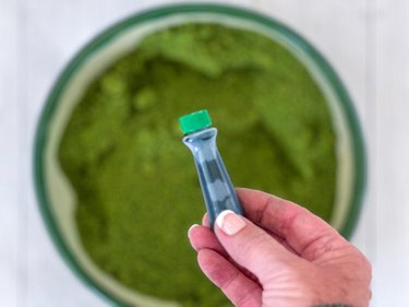 mix green food coloring into crushed graham crackers