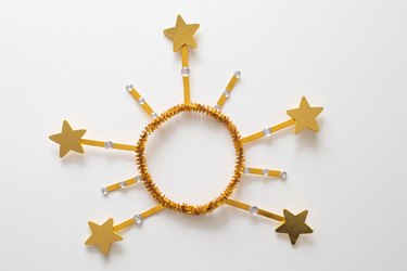 Star crown tree topper on a white background