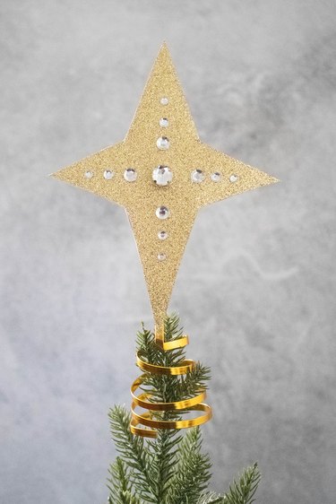 Pointed star tree topper on a tree