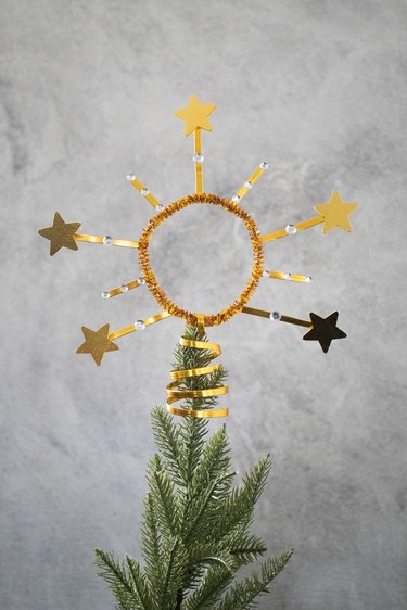 Star crown tree topper on a tree