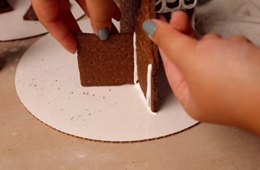 Attaching front and side of graham cracker house together