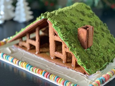 Gingerbread cabin with green edible moss roof