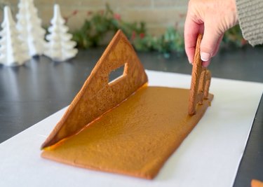 dip gingerbread into melted sugar and build house