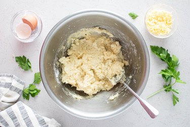 Mixing ingredients for mashed potato patties