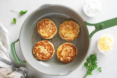 Cooking mashed potato patties in a skillet