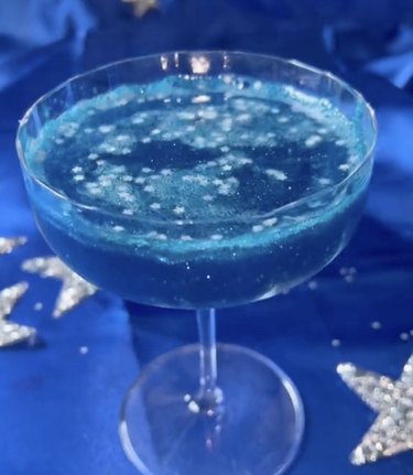 Sparkly blue cocktail with mini stars