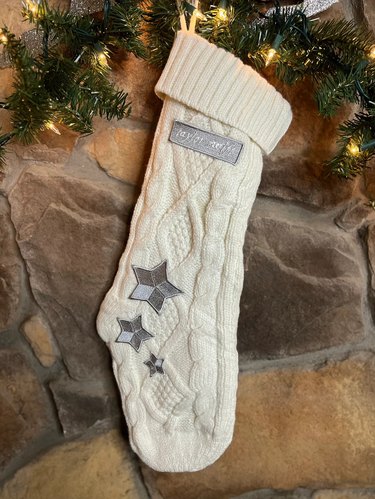 White crochet stocking with silver star appliqués