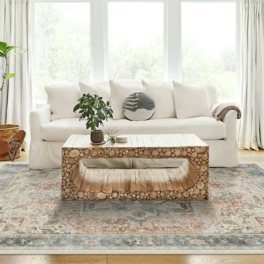 Machine-washable rug and pad in a vintage-inspired, distressed pattern with coral accents.