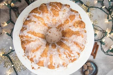 Overview of Bundt cake drizzled with white glaze