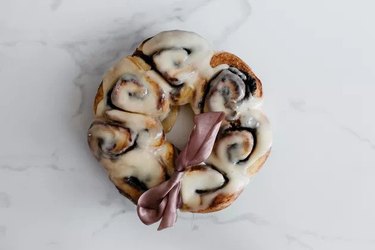 A cinnamon roll wreath on a white background