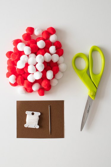 Supplies for red and white pompom garland