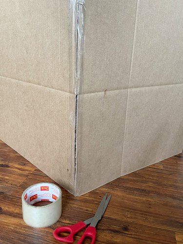 Assemble box with writing and images on the inside, and tape together with packing tape