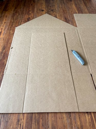 Cut door and triangle roof line on other large side of box