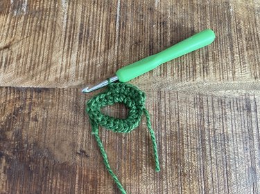 A circle ring of green crochet stitches