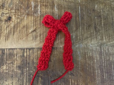 A red crochet bow