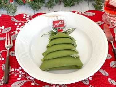 place setting with finished Christmas tree folded napkin