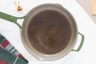 Melting dark corn syrup, brown sugar and butter in a pan