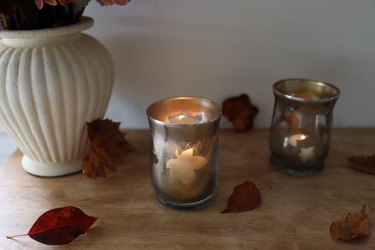 faux mercury glass candle holders with autumn leaf shapes