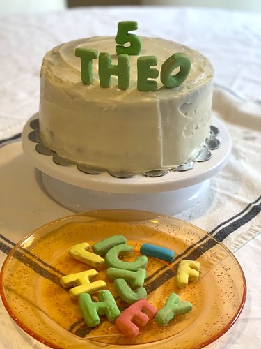 Birthday cake with alphabet primary-color name.