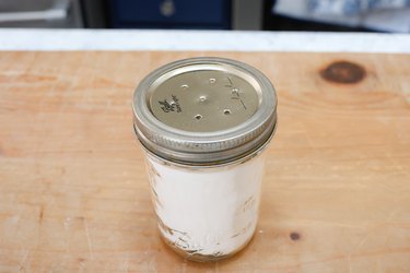 mason jar filled with holiday spice carpet sprinkle