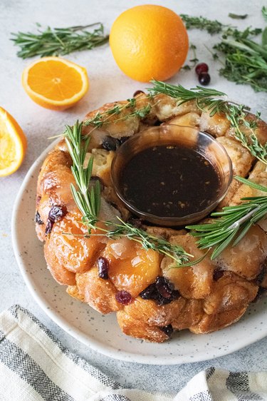 Cranberry-orange monkey bread wreath on a plate