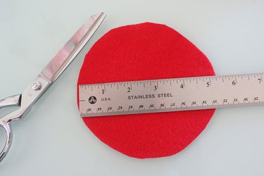 cutting a red felt circle