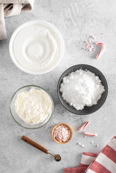 Ingredients for candy cane dip in various bowls