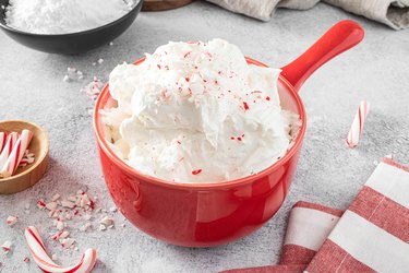 Candy cane dip in red bowl.