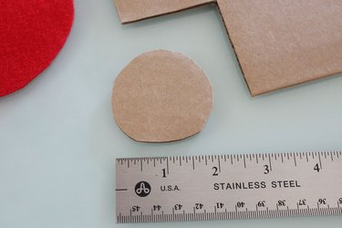 cutting out a circle of cardboard